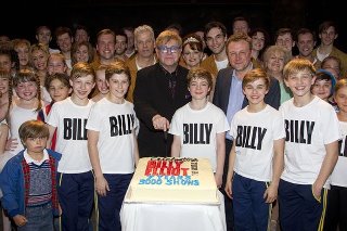 Elton John with cast and crew About to Enjoy the Cake