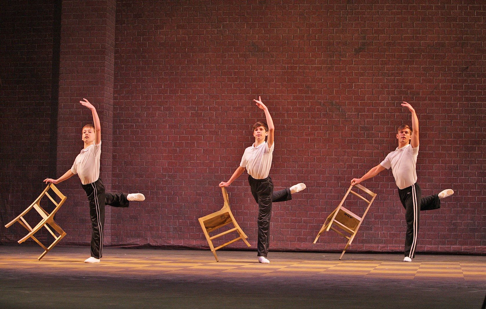 In the middle is Mitchell Tobin, the Billy for Music Theatre Wichita's production. On the left is Brandon Ranalli, Billy understudy. And on the right is Tanner Pflueger, dance captain, who played Billy on Broadway and the West End.